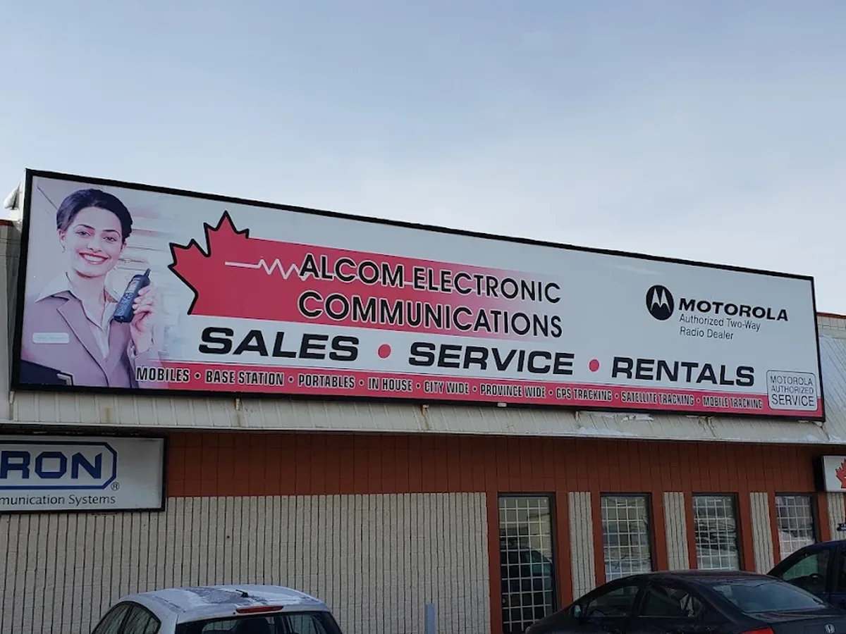 Alcom Electronic Communications storefront in Winnipeg with sales, service and rentals signage